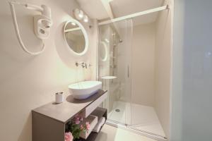 a white bathroom with a sink and a shower at BASTINICA KRK Studio Ap 2, OldTown, CityCenter in Krk