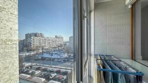 a view of a city from a window of a building at Business Class Apartments in the City Center in Chişinău