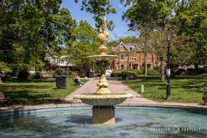 a fountain with a statue in the middle of a park at Glamorous 2-bedroom, Central location, Scenic Views - Central Park Suite in Parkstone