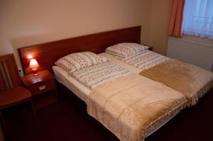 En eller flere senge i et værelse på OW Patryn