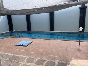an overhead view of a swimming pool at Green House with Pool in Bonorejo