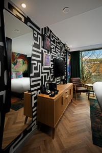 A bed or beds in a room at NYX Hotel Dublin Portobello