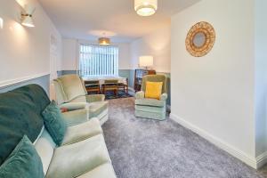a living room with a couch and two chairs at Host & Stay - St Mark's Close in Marske-by-the-Sea