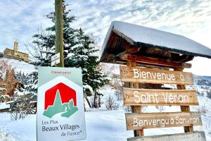 a sign for a ski lodge in the snow at CASA-La Lobio foot of the slopes breathtaking views 4p in Saint-Véran