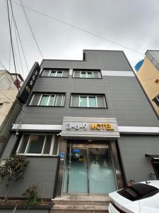 a building with a motel sign in front of it at 369 Motel in Mokpo