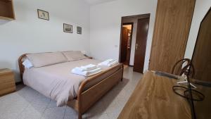Postel nebo postele na pokoji v ubytování Albergo Meublé Aurora