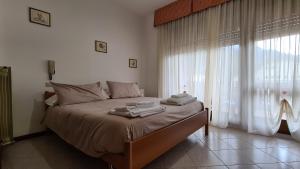 Postel nebo postele na pokoji v ubytování Albergo Meublé Aurora