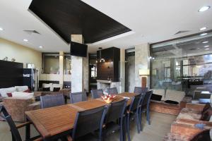 a dining room with a table and chairs at Alpine Lodge Bansko Apartments in Bansko