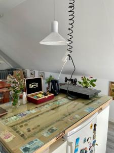 a glass counter top with a computer on top of it at Grethelund - 50m2 in Silkeborg