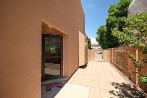 a building with a glass door on the side of it at Home near Balloon Fiesta Park! in Albuquerque