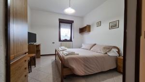 Postel nebo postele na pokoji v ubytování Albergo Meublé Aurora