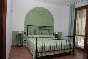 เตียงในห้องที่ Agriturismo Il Rustico