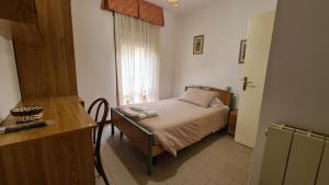 Postel nebo postele na pokoji v ubytování Albergo Meublé Aurora