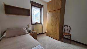 Postel nebo postele na pokoji v ubytování Albergo Meublé Aurora