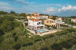an aerial view of a house with a swimming pool at Villa Boiky - private pool and amazing sea view, Istria in Materada