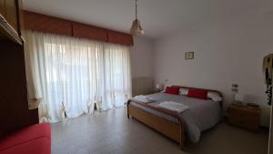 Postel nebo postele na pokoji v ubytování Albergo Meublé Aurora