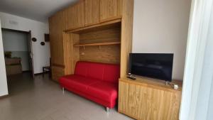 TV a/nebo společenská místnost v ubytování Albergo Meublé Aurora