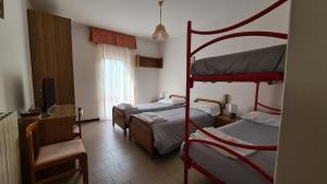 Postel nebo postele na pokoji v ubytování Albergo Meublé Aurora