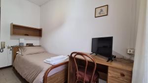 Postel nebo postele na pokoji v ubytování Albergo Meublé Aurora