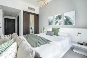 Postelja oz. postelje v sobi nastanitve GuestReady Holiday Homes - Concrete Jungle