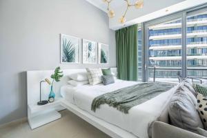 Postelja oz. postelje v sobi nastanitve GuestReady Holiday Homes - Concrete Jungle