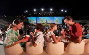 a group of people sitting on chairs at a concert at Torreserena Resort in Ginosa Marina