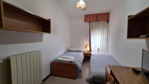 Postel nebo postele na pokoji v ubytování Albergo Meublé Aurora