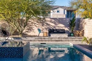 a swimming pool in a yard with a house at Sueno Terra Lago Luxury Pool House in Indio