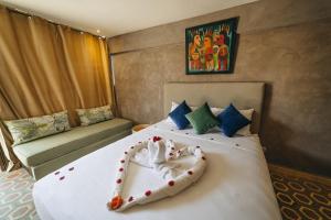 Postel nebo postele na pokoji v ubytování Hotel & Riad Veridis