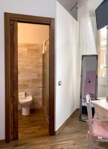 a bathroom with a toilet and a sink at Dani's House - affittacamere nel cuore di Cagliari in Cagliari +63 photos