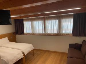 Postel nebo postele na pokoji v ubytování Agritur Anselmi