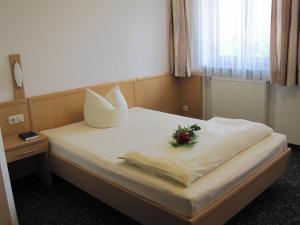 Postel nebo postele na pokoji v ubytování Hotel Jagermo