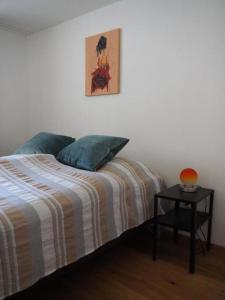 Кровать или кровати в номере Appartement Gmeindmatte