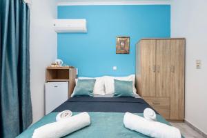 Postel nebo postele na pokoji v ubytování Lefteris Apartment