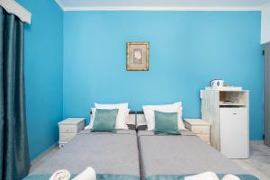 Postel nebo postele na pokoji v ubytování Lefteris Apartment