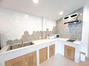 a kitchen with a sink and a counter at 48 House in Patong Beach