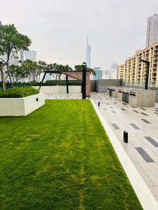 a green lawn on the roof of a building at Sentral Luxury Suites KL in Kuala Lumpur
