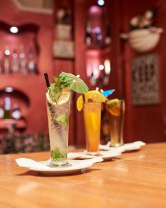 two drinks are sitting on a table with napkins at Hotel Waterbuck in Nakuru