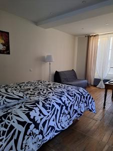 Postel nebo postele na pokoji v ubytování Au P'tit Gueul'ton