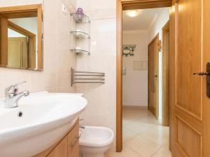 a white bathroom with a sink and a toilet at NEW!! 1 Bedroom Vila Nova de Cacela in Vila Nova de Cacela +10 photos