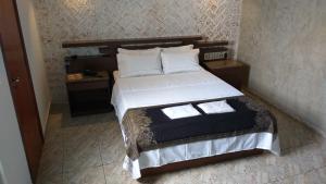 מיטה או מיטות בחדר ב-Millenium Hotel