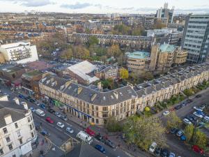 an aerial view of a city with buildings and cars at Ashton View in Glasgow