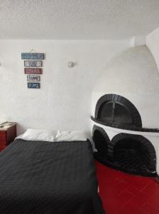 Postel nebo postele na pokoji v ubytování Hotel chimenea calle 100