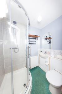 a bathroom with a shower and a toilet and a sink at Warm&Welcoming City Centre Apartments by Meadows 8 in Edinburgh