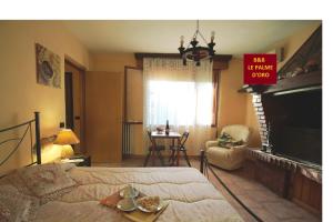 Postel nebo postele na pokoji v ubytování B&B Le Palme d'Oro