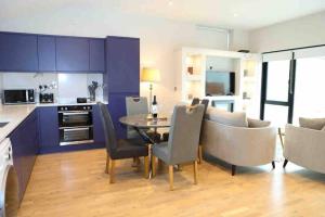 a kitchen and dining room with a table and chairs at 5* Self Catering 1 Bed in Nenagh