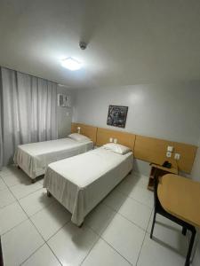 Postel nebo postele na pokoji v ubytování Absolutte Hotel