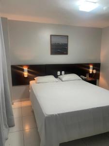 Postel nebo postele na pokoji v ubytování Absolutte Hotel