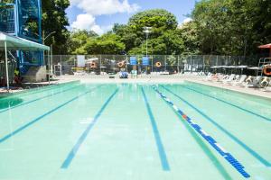 a large swimming pool withkeredkered lanes in it at Sesc Venda Nova in Belo Horizonte