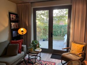Posezení v ubytování Luxe B&B "In de Schulp", ontspan en geniet van comfort en stijl
